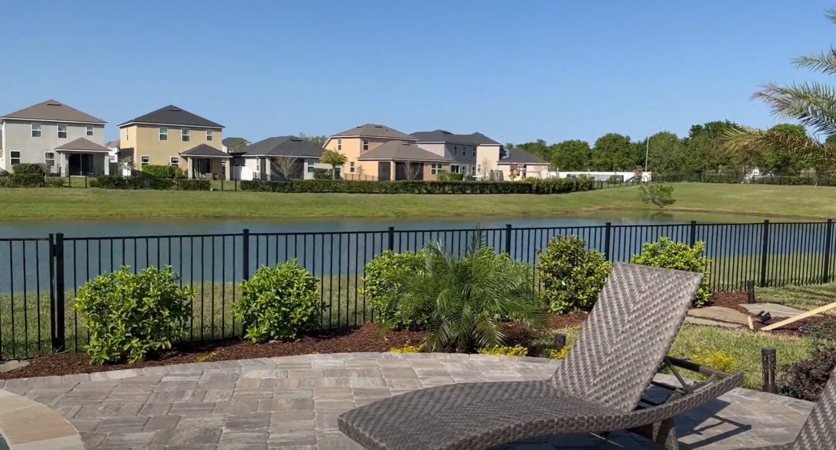 Elegant patio with decorative fence and professional landscaping
