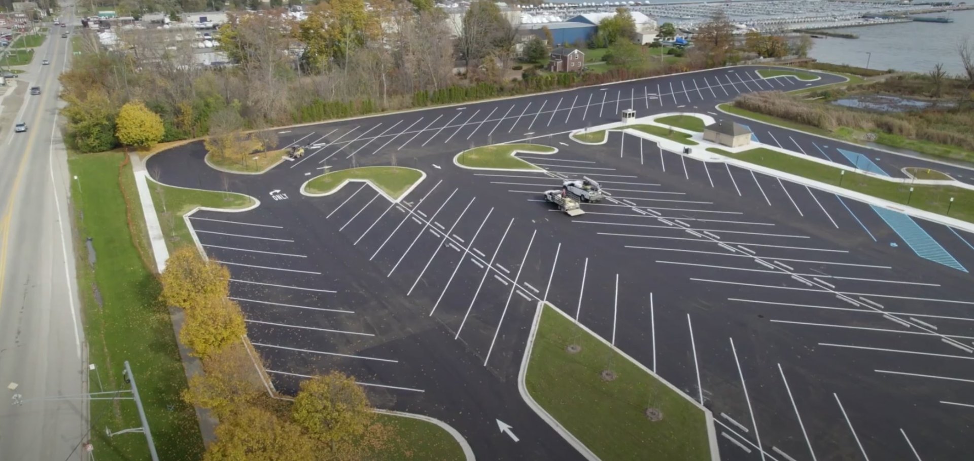 Commercial landscape installation showing organized parking lot design with integrated green spaces